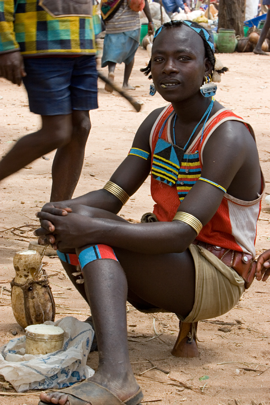134   Bana boy selling scheese on the market